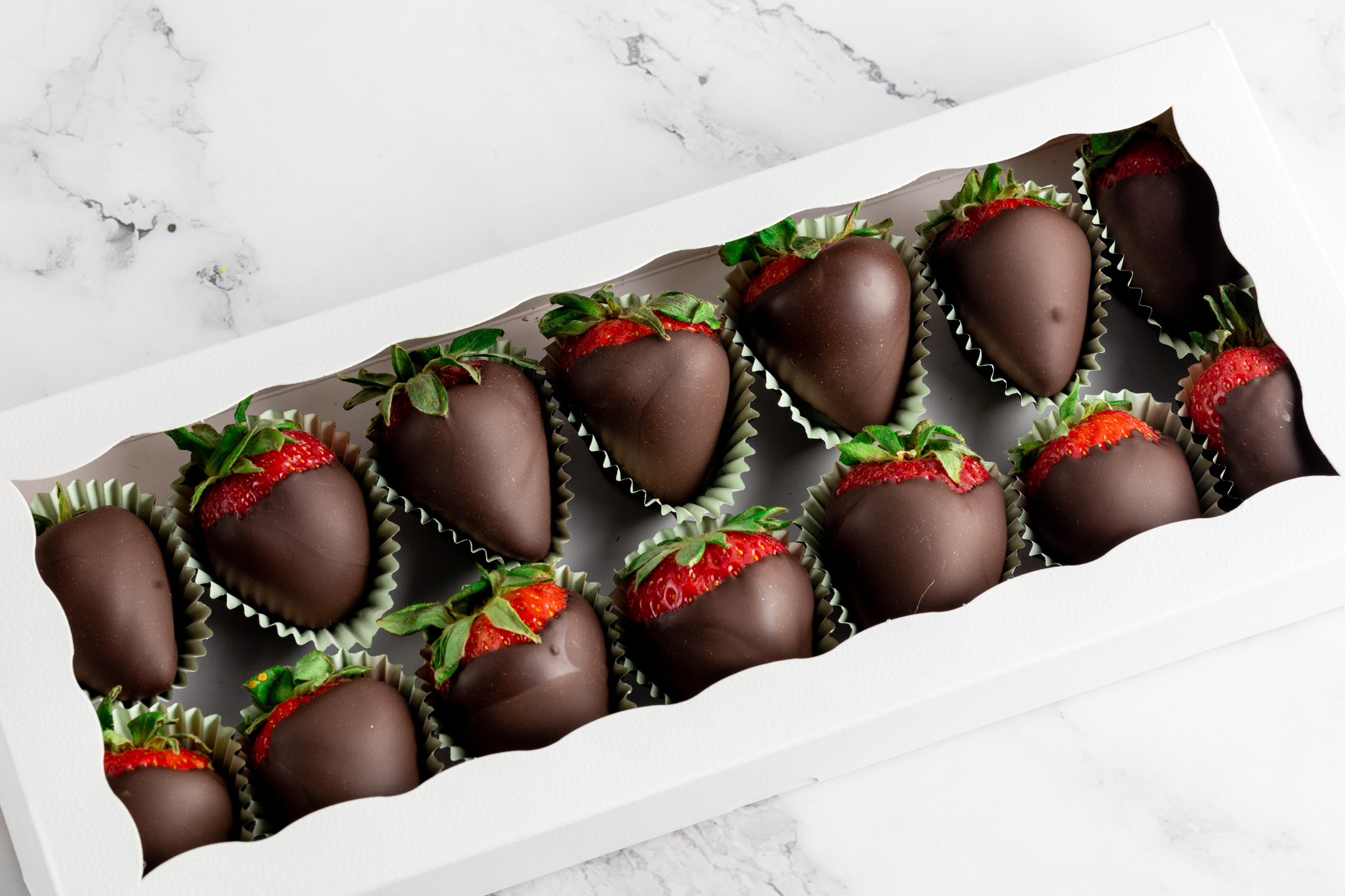 Belgian chocolate strawberries close-up showing smooth couverture shell