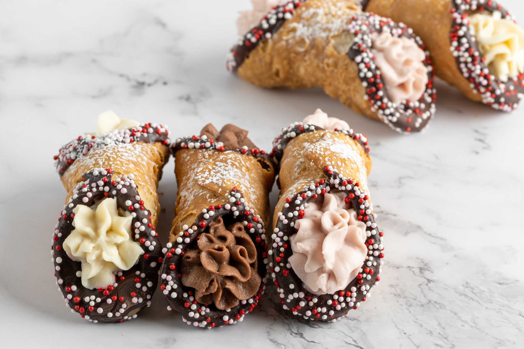 Belgian chocolate-dipped Cannoli ends showing couverture coating