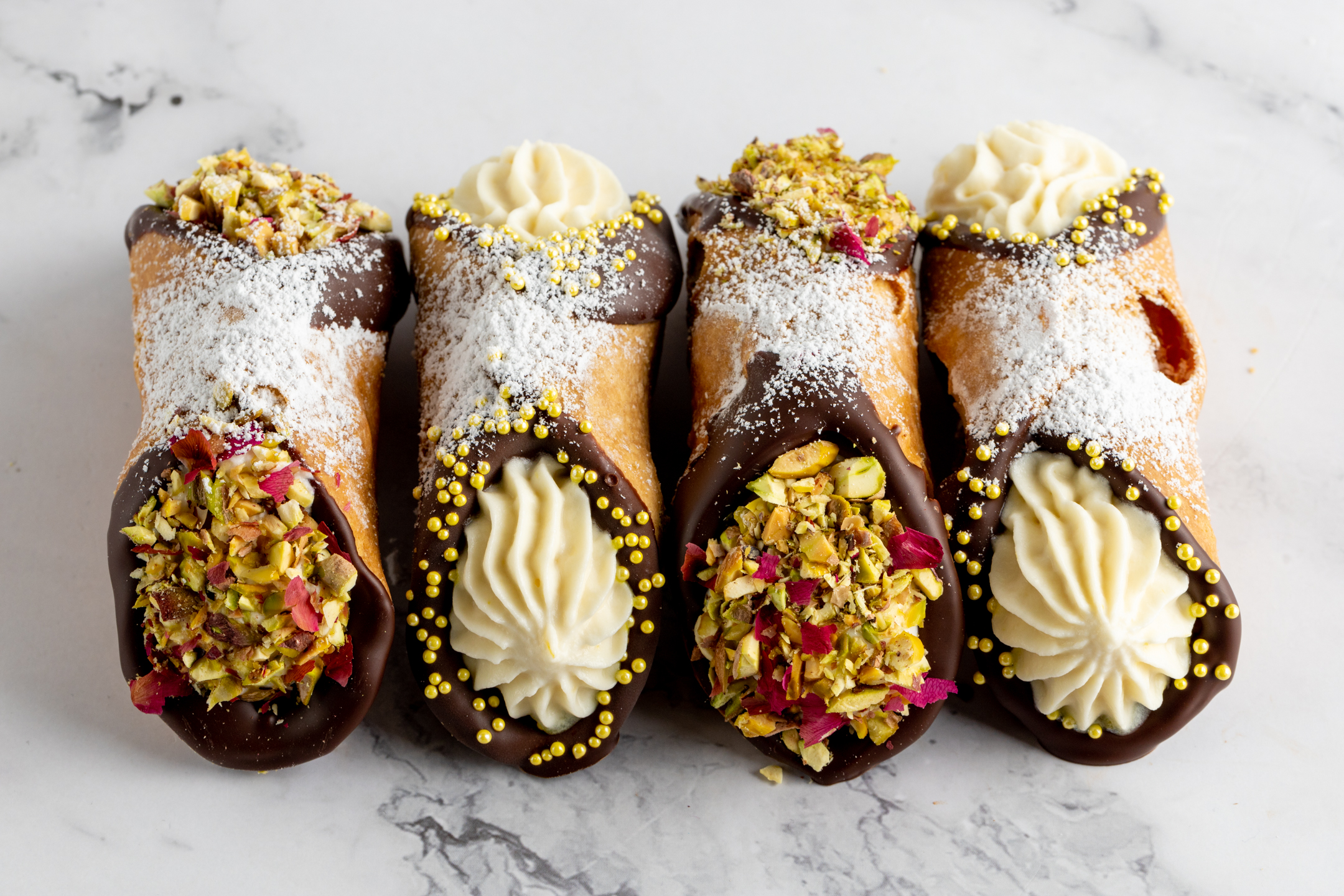 Luxe Cannoli close-up showing Belgian couverture chocolate shell and ricotta filling