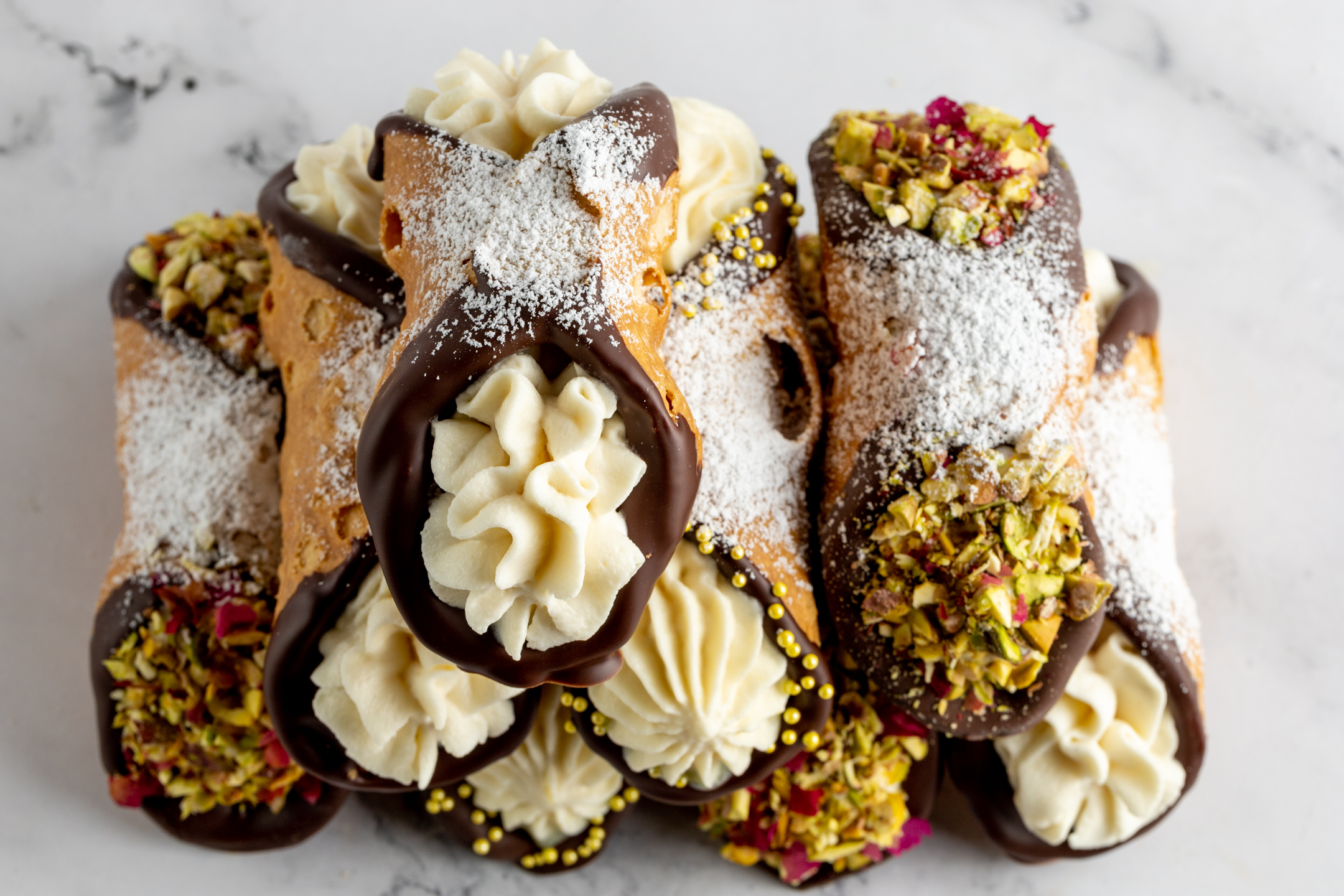 Assorted Sicilian Cannoli flavours — vanilla, Belgian chocolate, raspberry, lemon curd and pistachio rose
