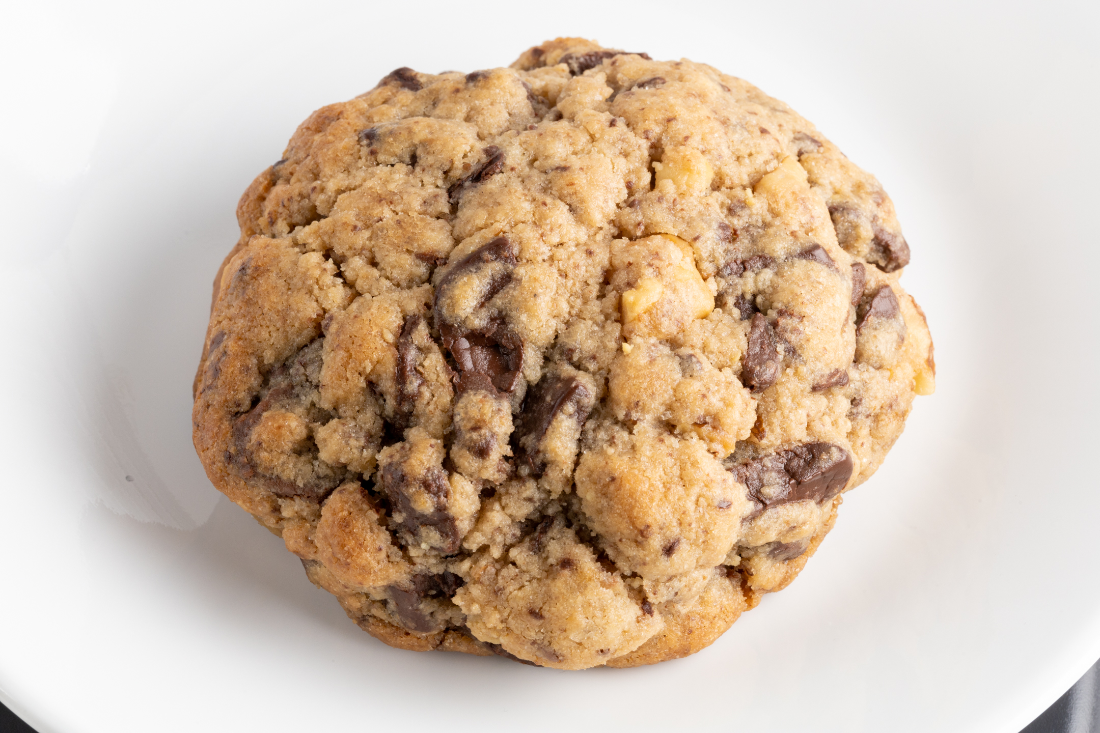 Quarter Pound Chocolate Chunk Walnut Cookie close-up showing Belgian chocolate chunks and toasted walnuts