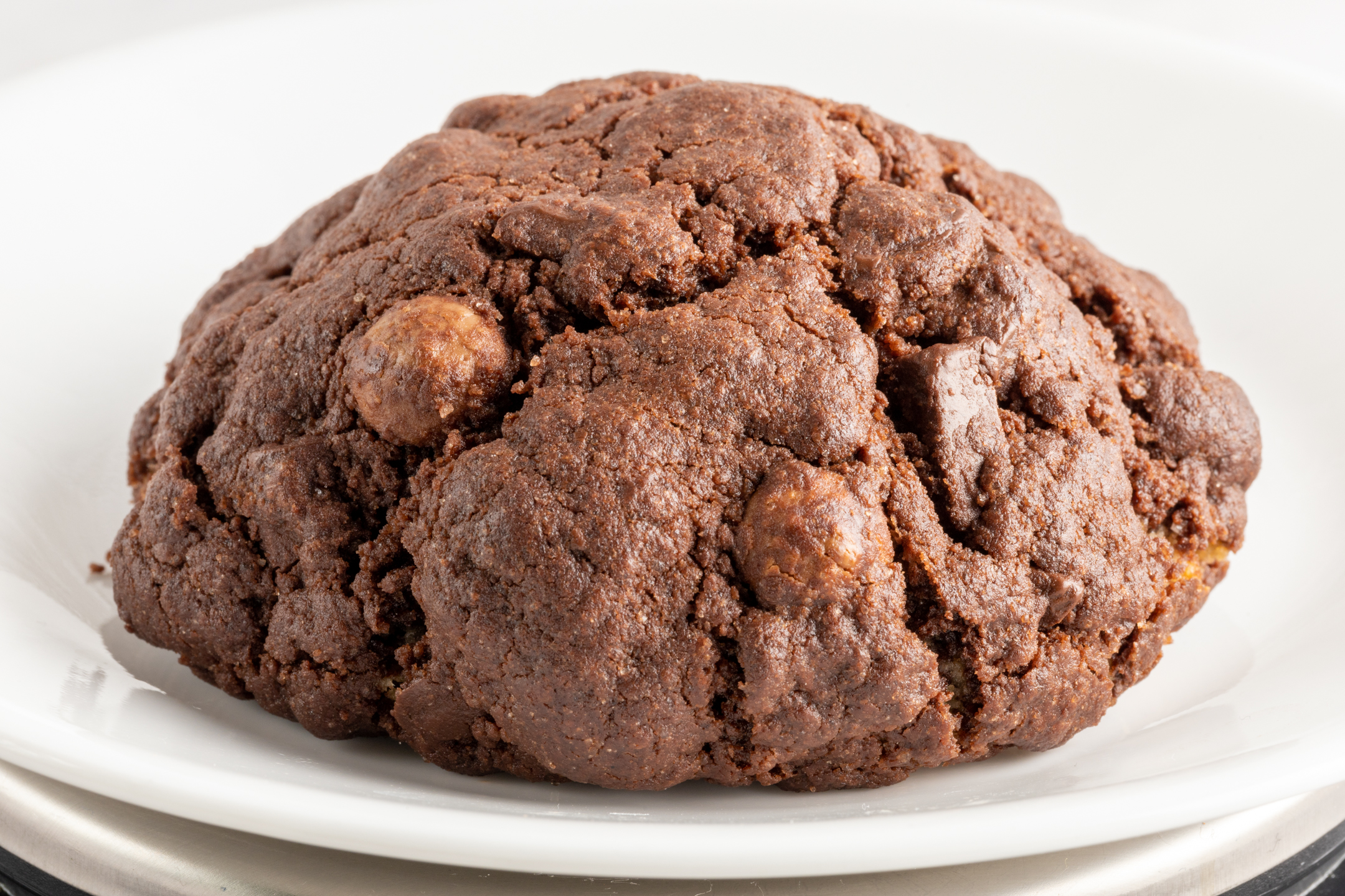 Dark Couverture Chocolate Cookie close-up showing pools of melted Belgian chocolate chunks