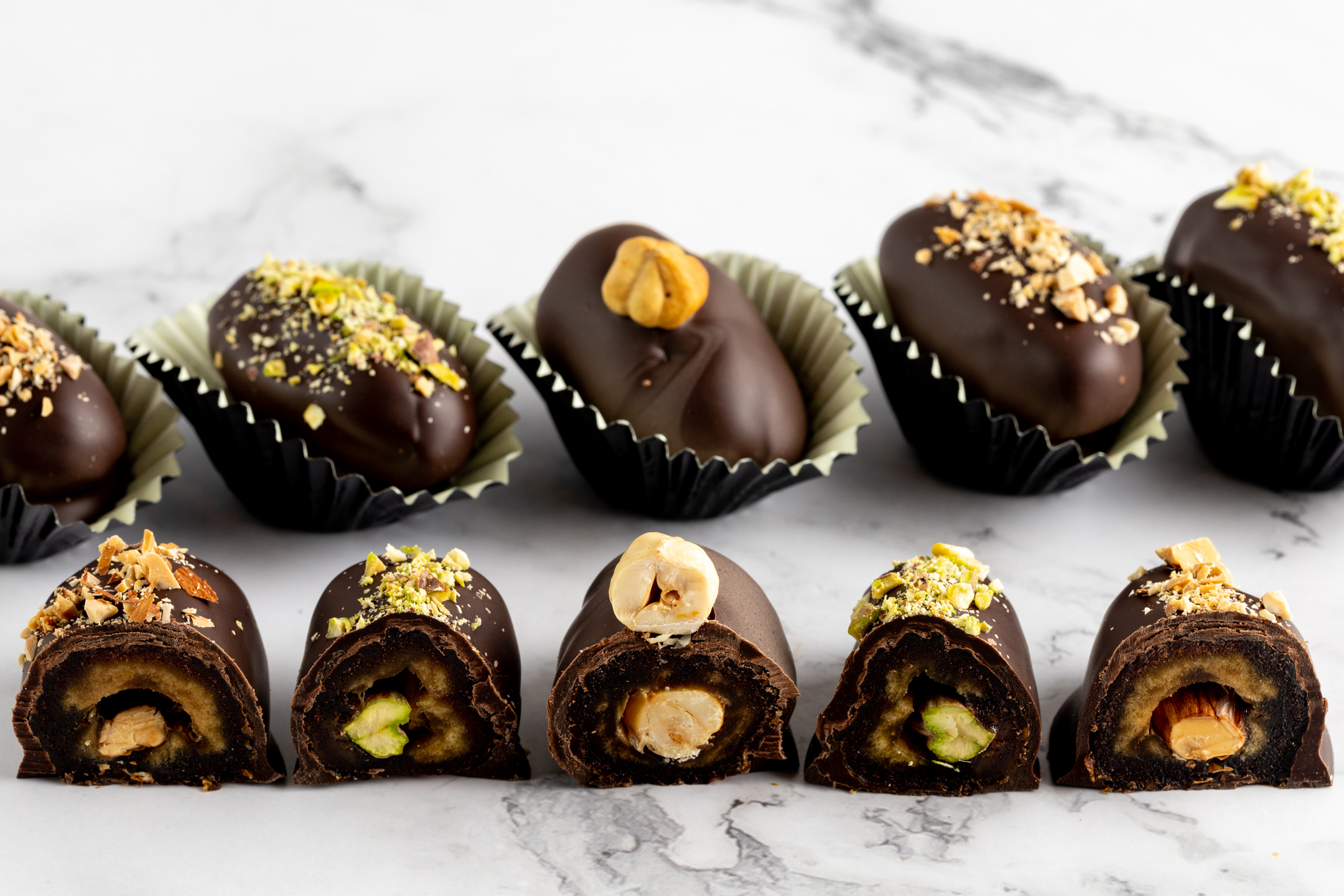 Truffles Date and Roasted Nut by Sucré — Medjool dates stuffed with roasted pistachio, hazelnut or almond then coated in Belgian couverture chocolate
