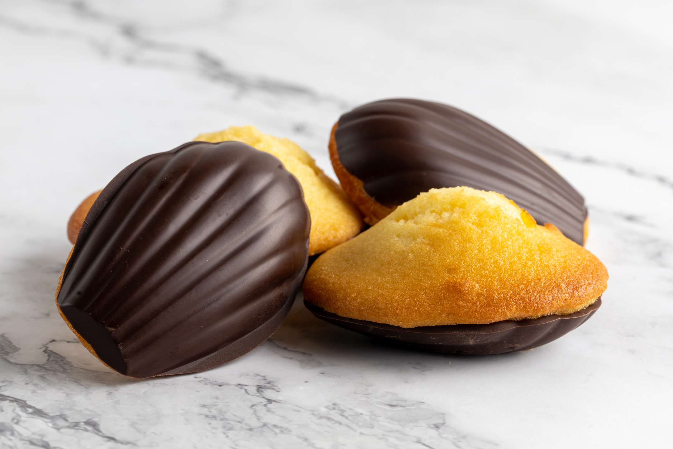 French Madeleines dipped in Belgian couverture chocolate by Sucré