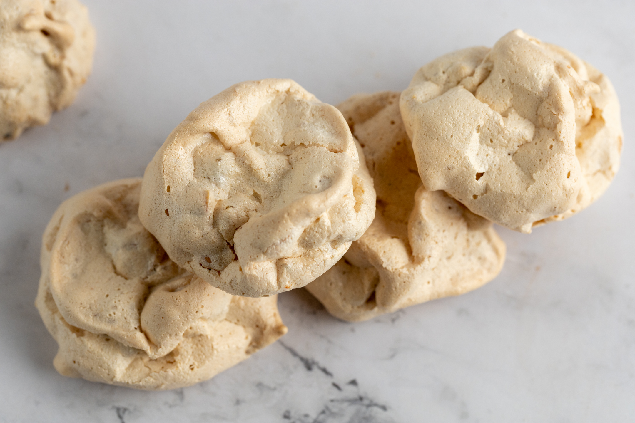Brutti Ma Buoni close-up showing crunchy exterior and chewy meringue-like center