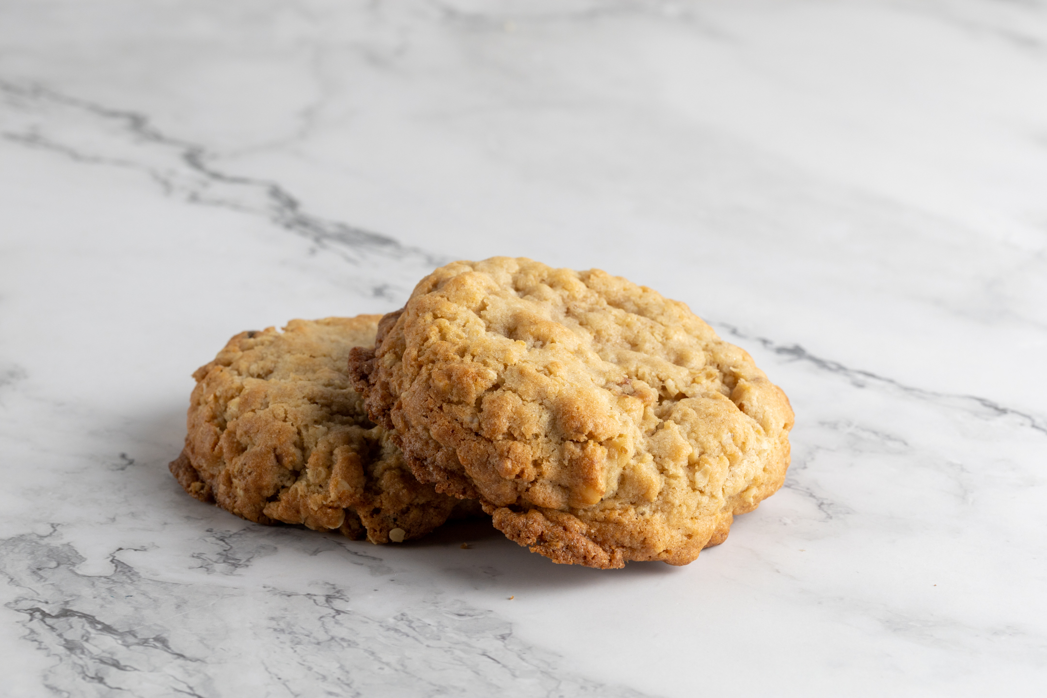 Walnut Oatmeal Cookie close-up showing oatmeal texture with in-house roasted California walnuts