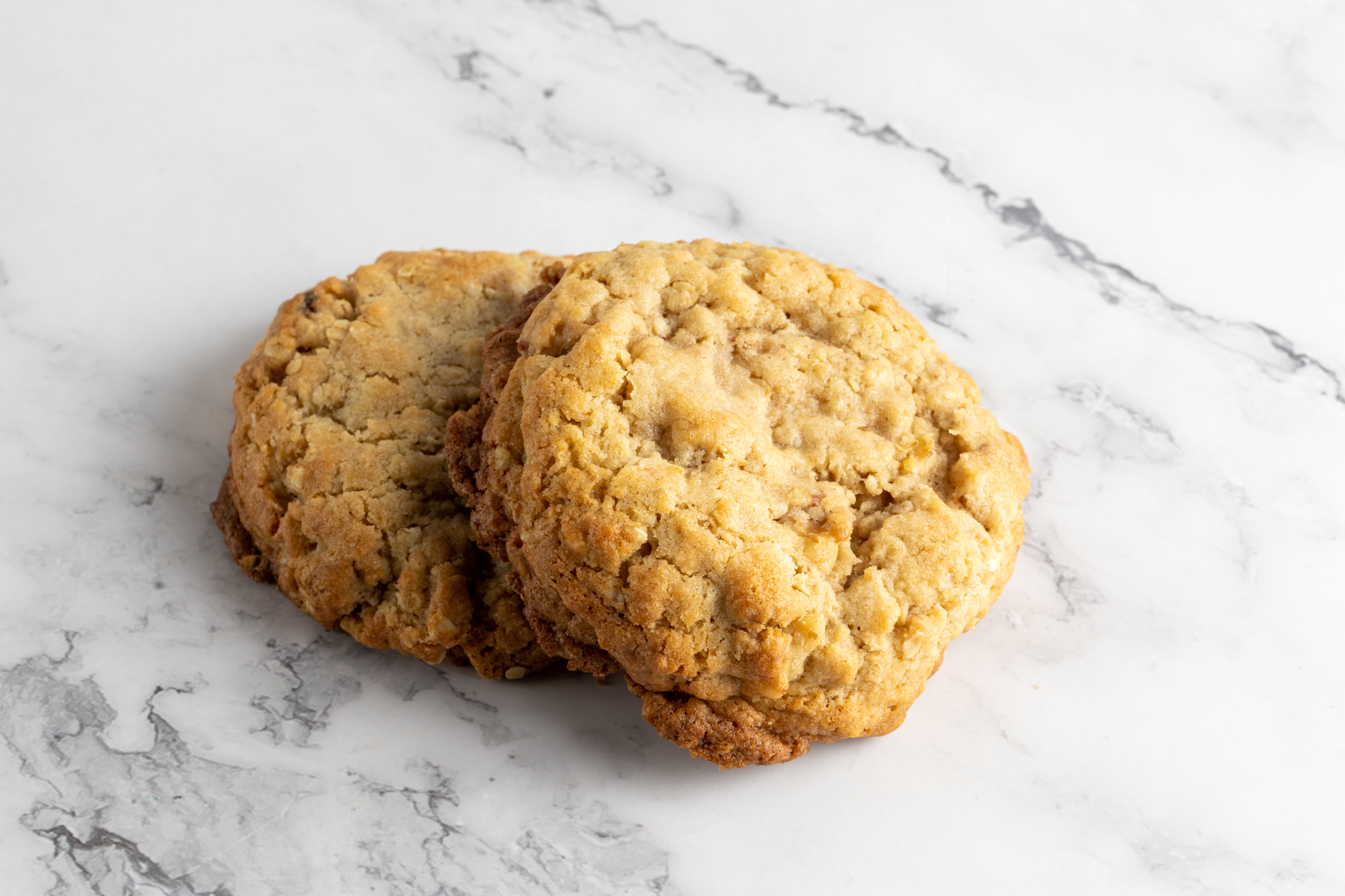 Quarter Pound Walnut Oatmeal Cookie stack showing thickness and natural oat texture