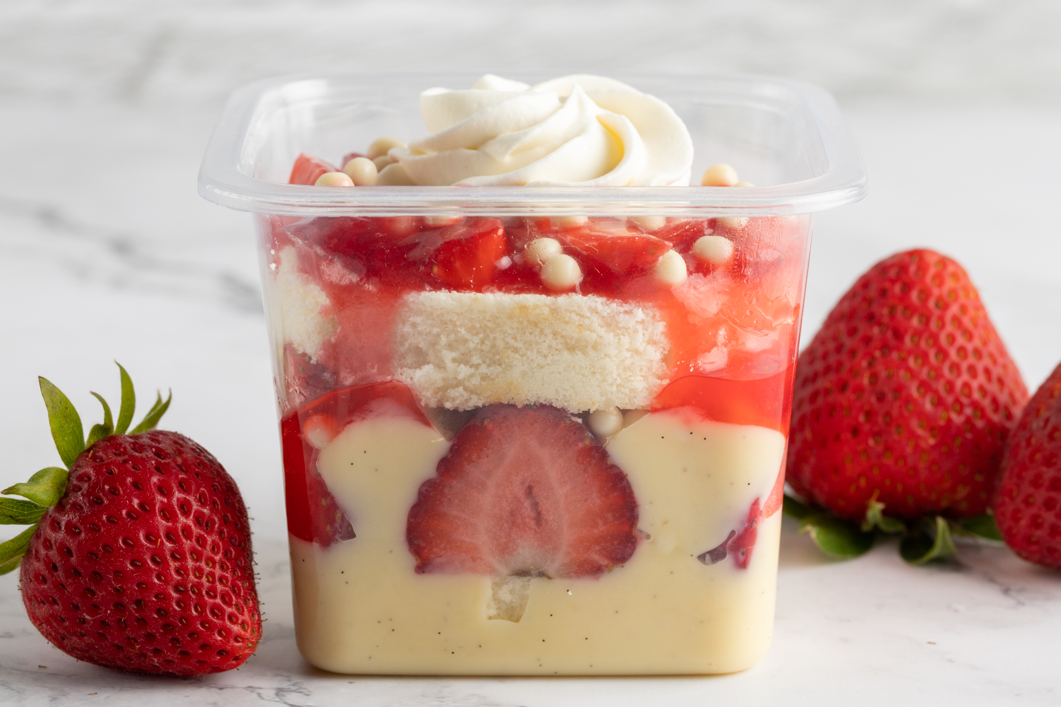 Fraisier cross-section showing layers of White Velvet sponge, crème pâtissière and strawberries