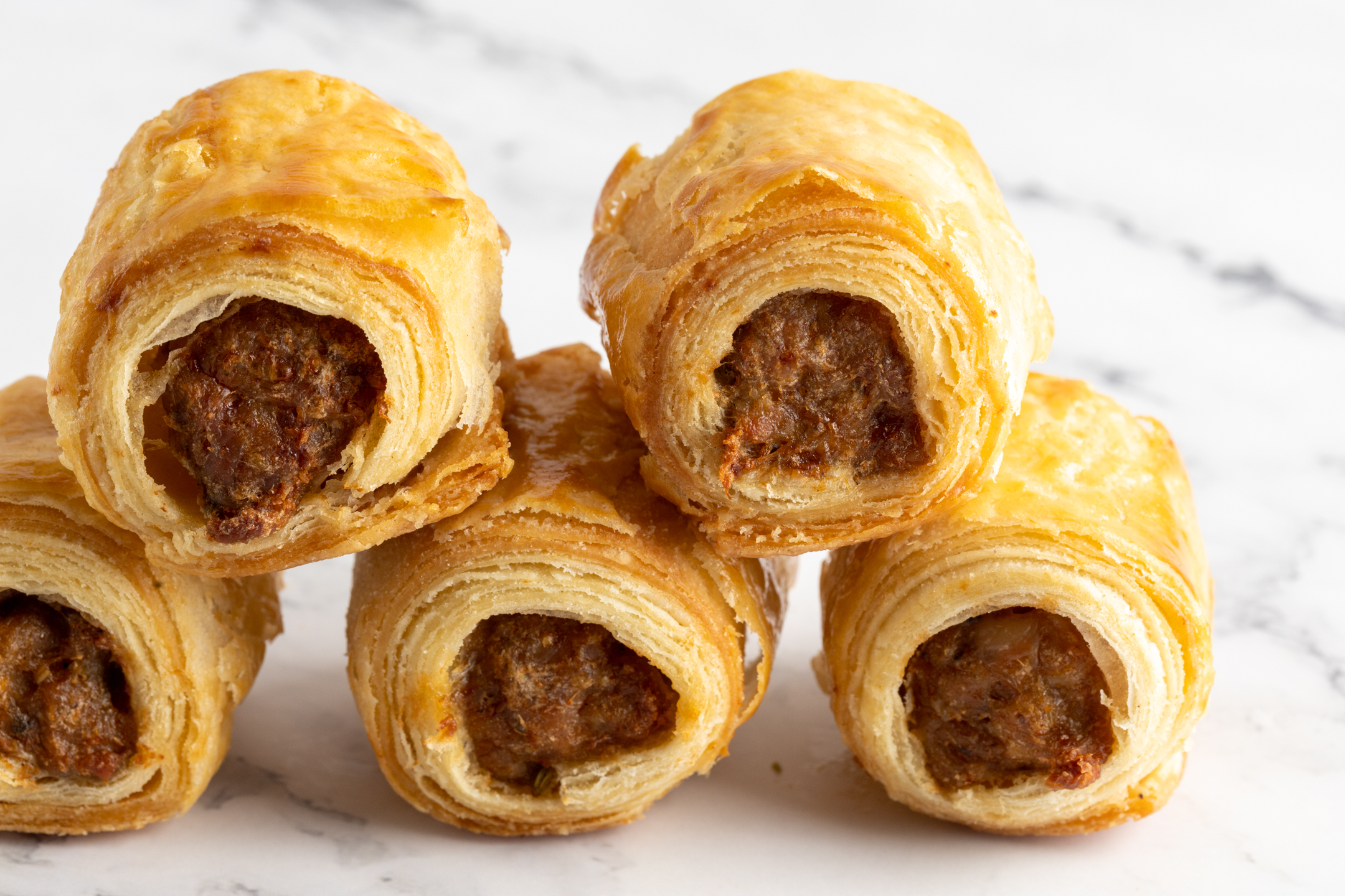 Mini Luxe Sausage Rolls by Sucré — all-butter puff pastry with halal AAA sirloin beef or halal chicken filling