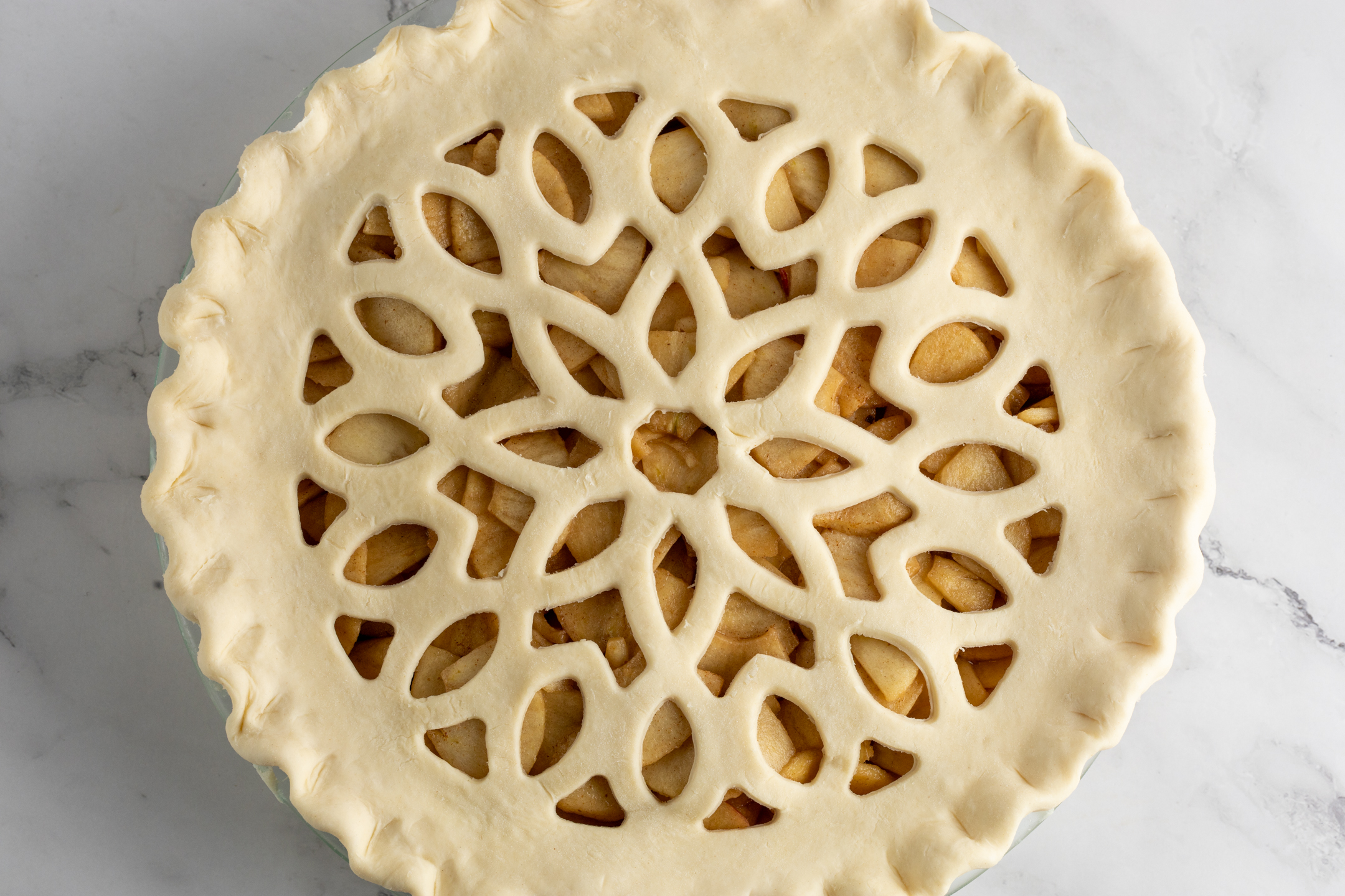 Honeycrisp Apple Pie with geometric lattice crust in eco-conscious reusable glass baking dish by Sucré