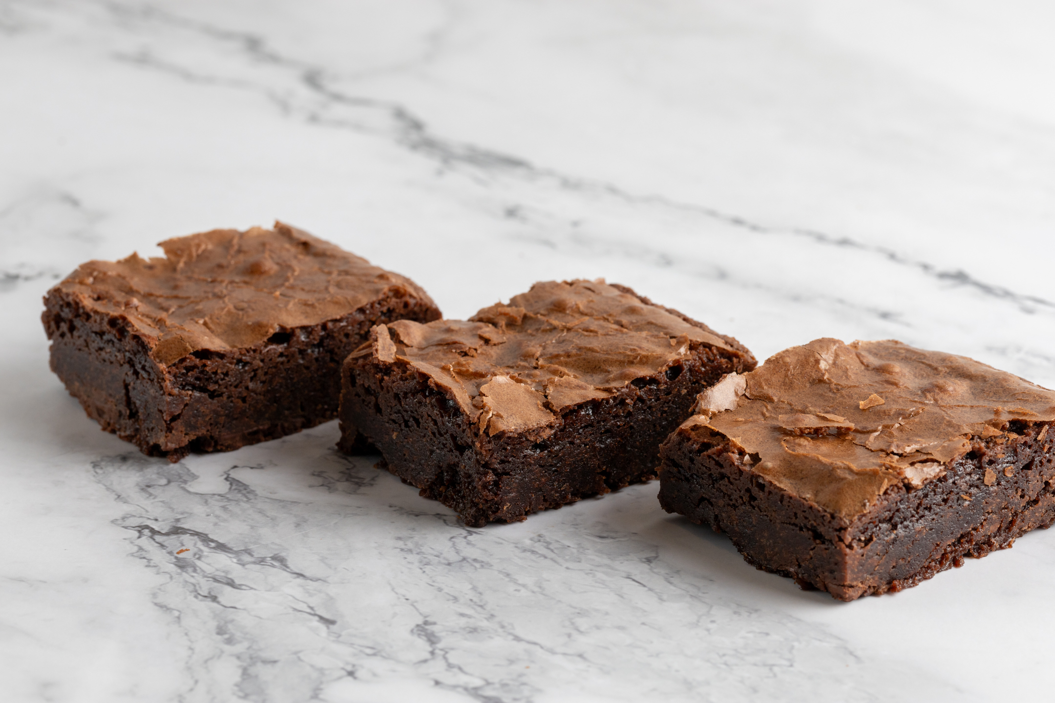 Belgian Chocolate Brownie cross-section showing irresistibly fudgy gooey center
