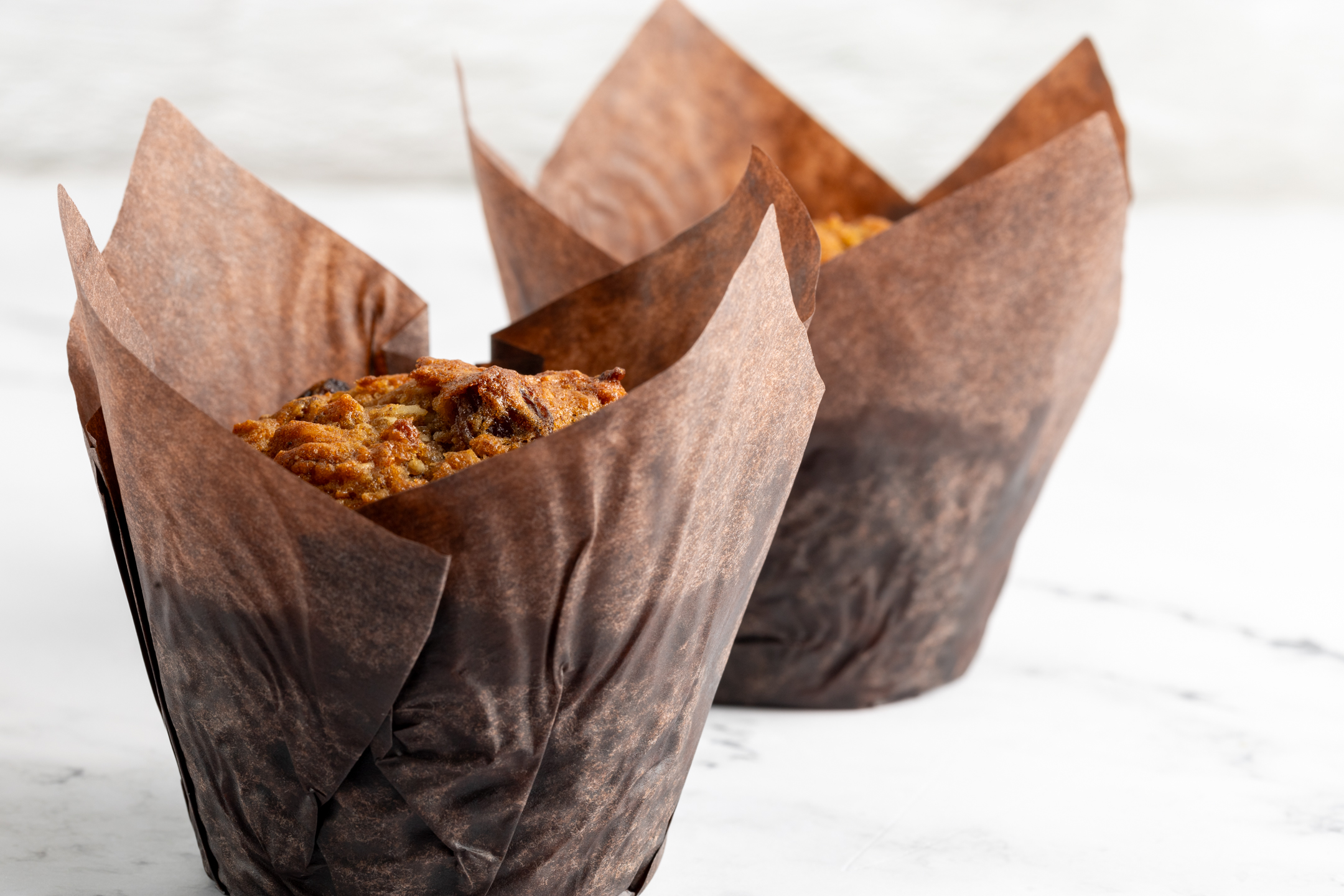 Morning Glory Muffin close-up showing golden domed top with oat bran