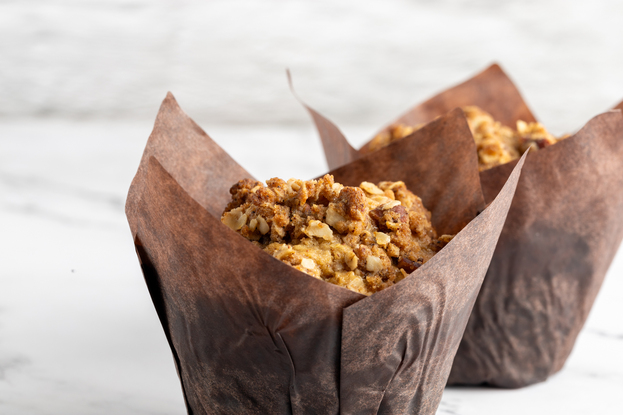 Oat and Pecan Delight Muffin cross-section showing tender interior with toasted oats and pecans